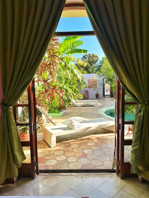 Deluxe Quadruple Room, 2 Queen Beds, Private Bathroom | In-room safe, iron/ironing board (on request), WiFi (free), bed sheets