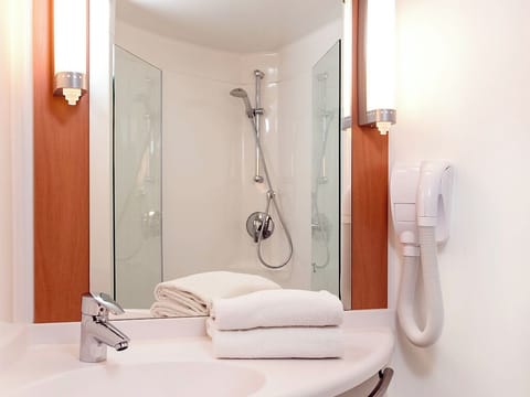 Shower, eco-friendly toiletries, hair dryer, towels
