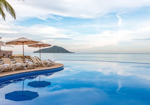 Outdoor pool, open 9:00 AM to 9:00 PM, pool umbrellas, sun loungers