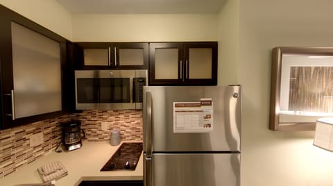 Full-size fridge, microwave, stovetop, dishwasher