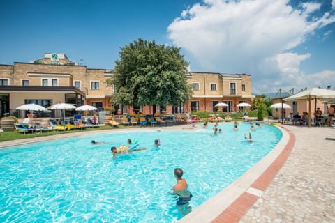 Outdoor pool, pool umbrellas, sun loungers