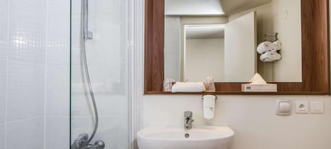 Premium bedding, desk, laptop workspace, blackout drapes