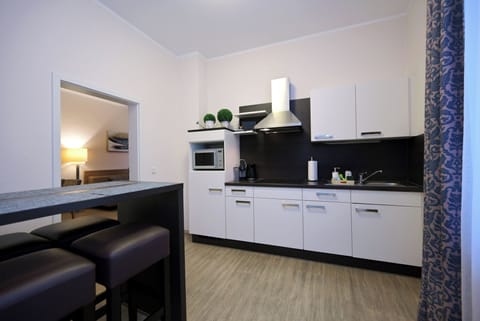 Comfort Apartment, Kitchen, Annex Building (Wormser Str. 11) | Private kitchen | Shared fridge, microwave