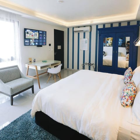 Deluxe King Room | Premium bedding, down comforters, in-room safe, individually decorated