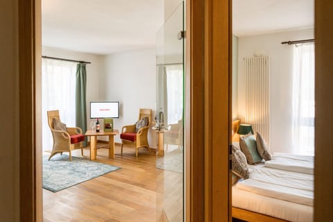 Suite, Balcony, Garden Area | Living area | Flat-screen TV