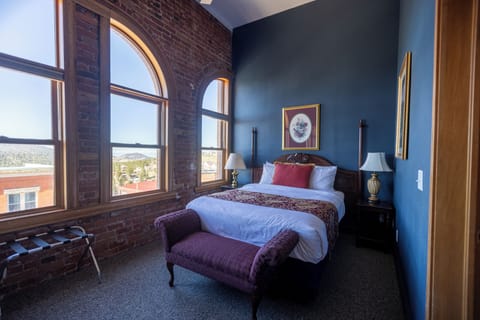 Deluxe Room, 1 Queen Bed (Top Floor) | Desk, laptop workspace, iron/ironing board, cribs/infant beds