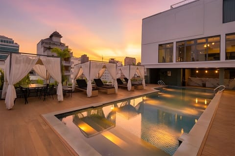 Outdoor pool, open 6:00 AM to 9:30 PM, pool umbrellas, sun loungers