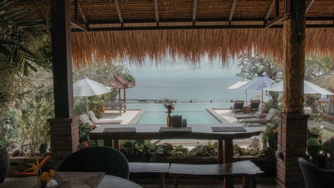 Outdoor pool, open 6 AM to 11 PM, pool umbrellas, sun loungers