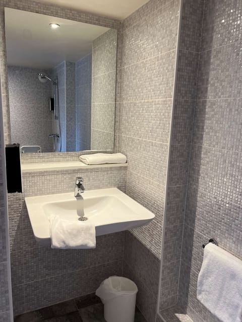 Combined shower/tub, eco-friendly toiletries, hair dryer, towels