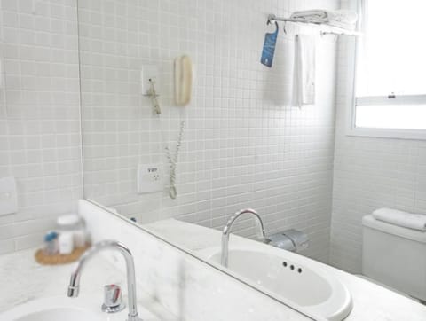 Shower, designer toiletries, hair dryer, towels