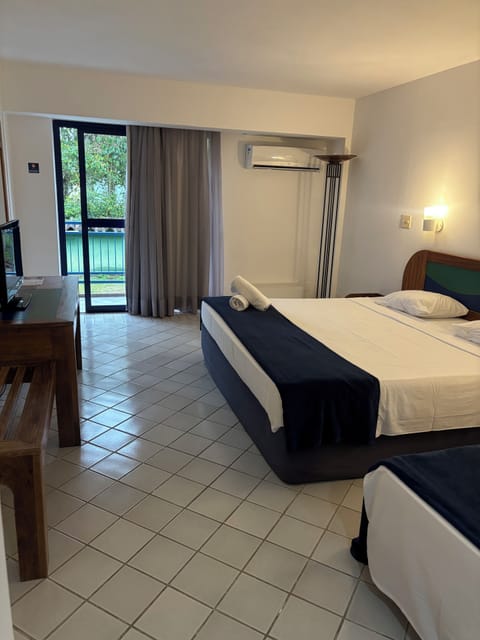 Superior Triple Room | Minibar, desk, blackout drapes, iron/ironing board