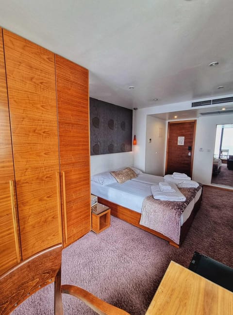 Classic Quadruple Room, Balcony | Down comforters, minibar, in-room safe, desk