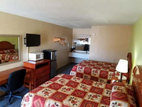 Desk, blackout drapes, iron/ironing board, rollaway beds