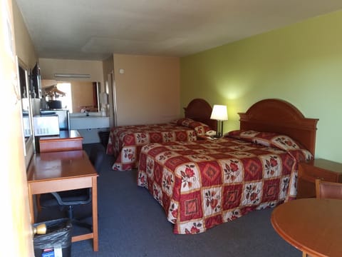 Desk, blackout drapes, iron/ironing board, rollaway beds