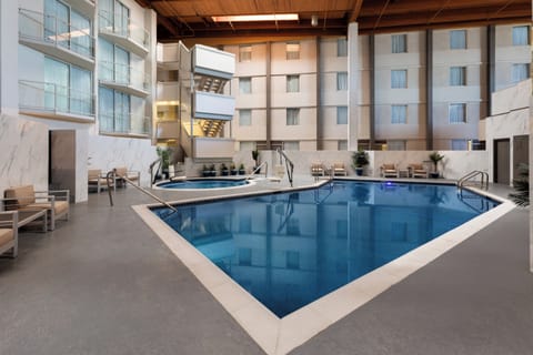 Indoor pool, seasonal outdoor pool, pool umbrellas, sun loungers