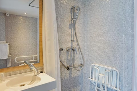 Comfort Room (accessible) | Bathroom | Shower, rainfall showerhead, eco-friendly toiletries, hair dryer