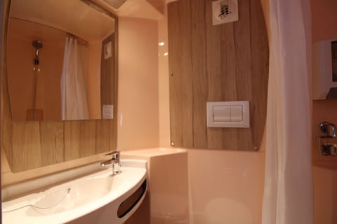 Shower, rainfall showerhead, eco-friendly toiletries, towels