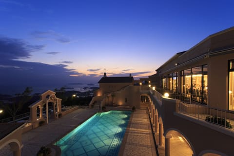 Seasonal outdoor pool, open 7:00 AM to 7:00 PM, pool umbrellas