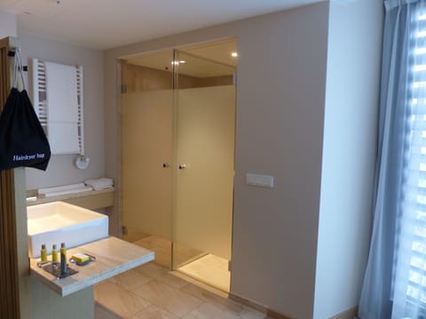 Grand Suite, 2 Bedrooms | Bathroom | Shower, rainfall showerhead, free toiletries, hair dryer