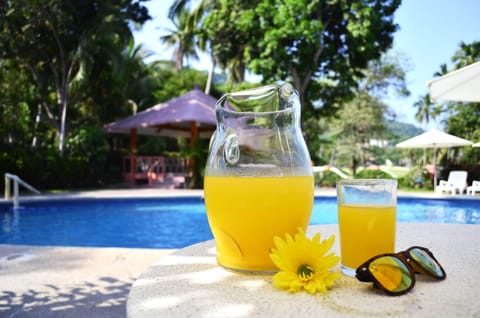 Outdoor pool, open 8:00 AM to 8:00 PM, pool umbrellas, sun loungers