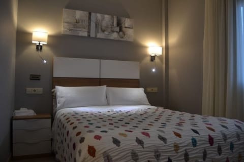 Premium bedding, desk, blackout drapes, soundproofing