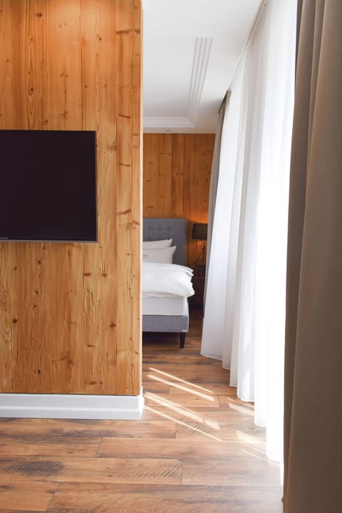 Chalet Suite, Balcony with garden view | Television