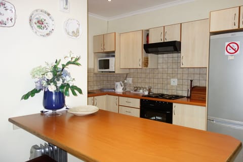 Deluxe Lavender Apartment | Living area | 32-inch LED TV with digital channels, TV