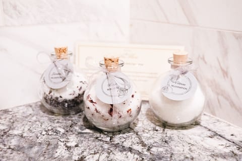 Designer toiletries, hair dryer, bathrobes, slippers