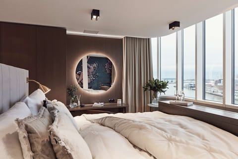 Premium bedding, down comforters, memory foam beds, minibar