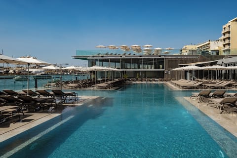 Indoor pool, outdoor pool, open 9:00 AM to 6:00 PM, pool umbrellas