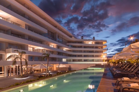 Indoor pool, seasonal outdoor pool, open 8 AM to 8:30 PM, pool umbrellas