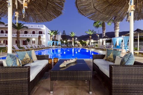 Seasonal outdoor pool, open 9:00 AM to 8:00 PM, pool umbrellas