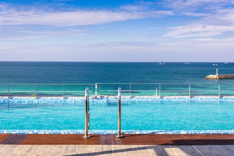 Outdoor pool, open 9:00 AM to 8:00 PM, sun loungers