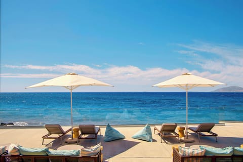 On the beach, sun loungers, beach umbrellas, beach volleyball