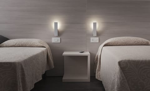 Quadruple Room, Annex Building | Minibar, in-room safe, desk, blackout drapes