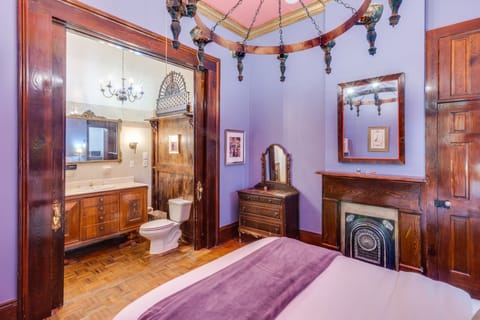 The Mardi Gras Room | Individually decorated, individually furnished, desk, iron/ironing board