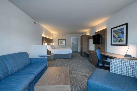 Premium bedding, desk, laptop workspace, blackout drapes