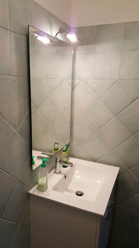 Family Apartment, 1 Bedroom, Patio | Bathroom | Shower, free toiletries, hair dryer, bathrobes