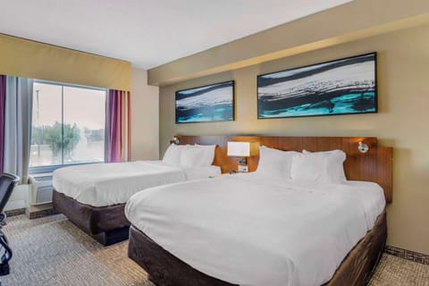 Suite, 2 Queen Beds & Sofa Bed, Non-Smoking | Down comforters, desk, laptop workspace, blackout drapes