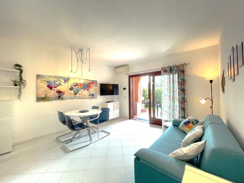 Apartment, 1 Bedroom | Living area | Flat-screen TV, toys