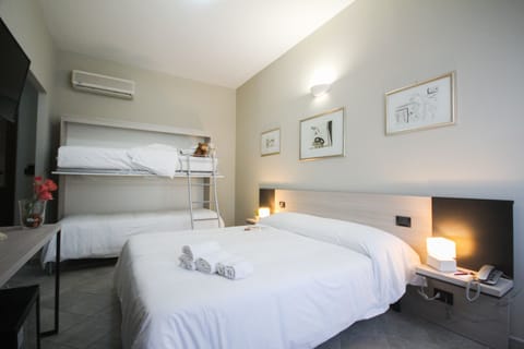 Quadruple Room | Down comforters, minibar, desk, blackout drapes