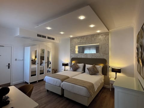 Double or Twin Room | Minibar, in-room safe, individually decorated, desk