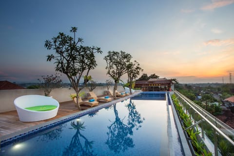 Outdoor pool, open 7:00 AM to 7:00 PM, pool umbrellas, sun loungers