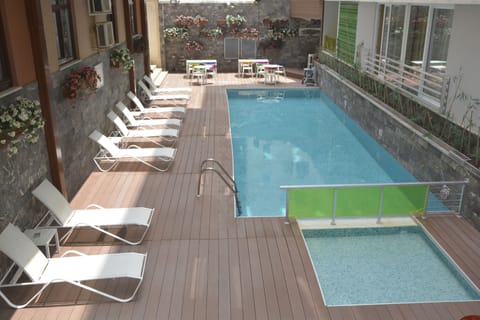 Outdoor pool, pool umbrellas, sun loungers