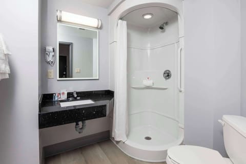 Desk, laptop workspace, blackout drapes, iron/ironing board