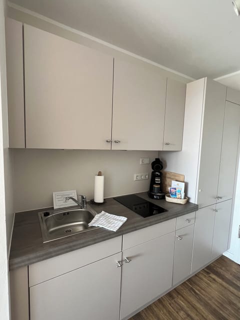 Deluxe Double Room, Terrace, Beach View | Private kitchen | Fridge, stovetop, coffee/tea maker, electric kettle