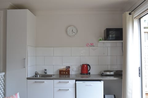 1-Bedroom Holiday Home | Private kitchenette | Fridge, microwave, oven, stovetop