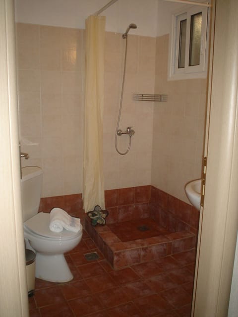 Apartment, Sea View | Bathroom | Shower, hair dryer, towels