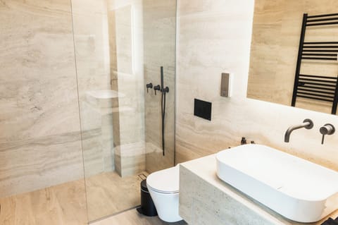 Shower, rainfall showerhead, designer toiletries, hair dryer