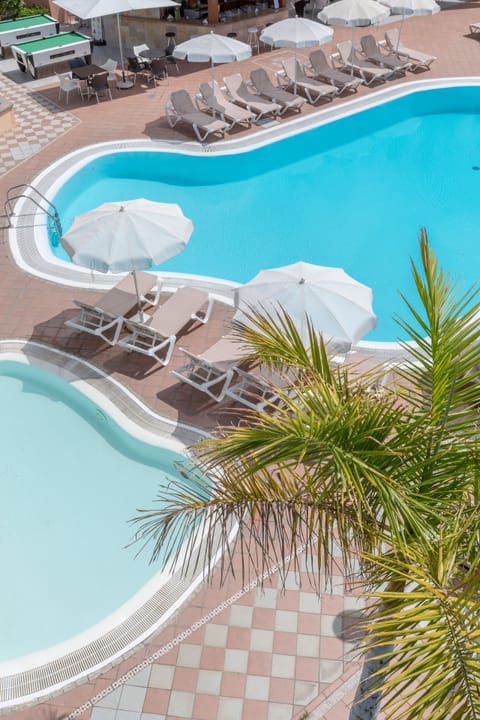 Outdoor pool, open 10:00 AM to 6 PM, pool umbrellas, sun loungers